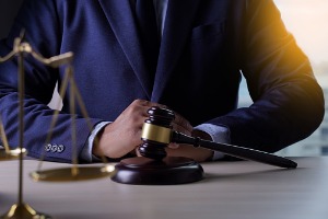 Criminal Attorney in Peoria IL sitting at a table with a gavel on it