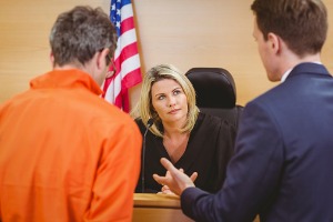 Criminal Attorney in Peoria IL next to his client and talking to the judge