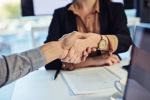 Commercial Property Lawyer in Peoria IL shaking hands with a client