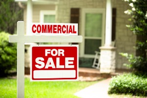 Commercial Property For Sale Real Estate Sign Outside of House