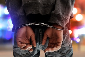 Man being arrested needing a Criminal Defense Attorney in Lewiston IL
