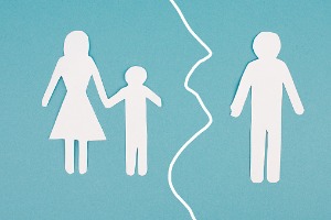 Paper dolls of of parents and a child, where the father is seperated